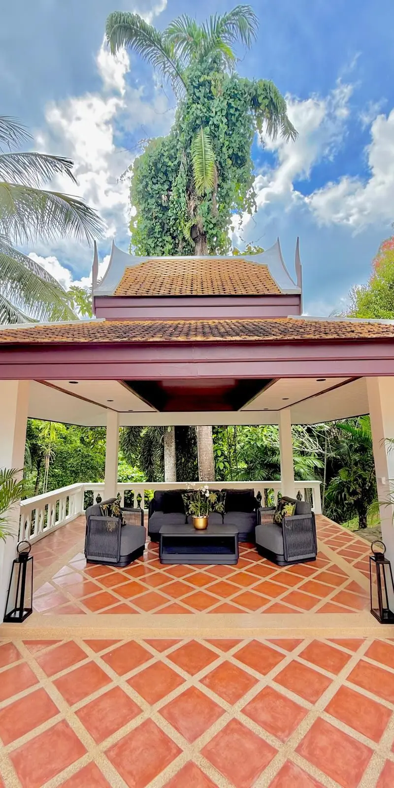 Outdoor sala pavilion entrance with hand-carved gable