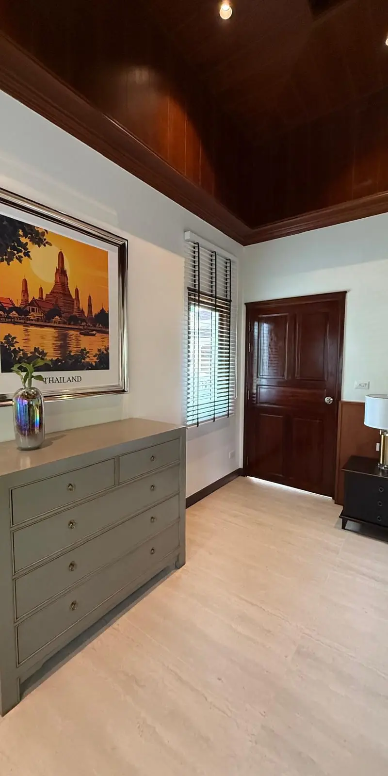 Guest bedroom with vintage Wat Arun Bangkok travel poster