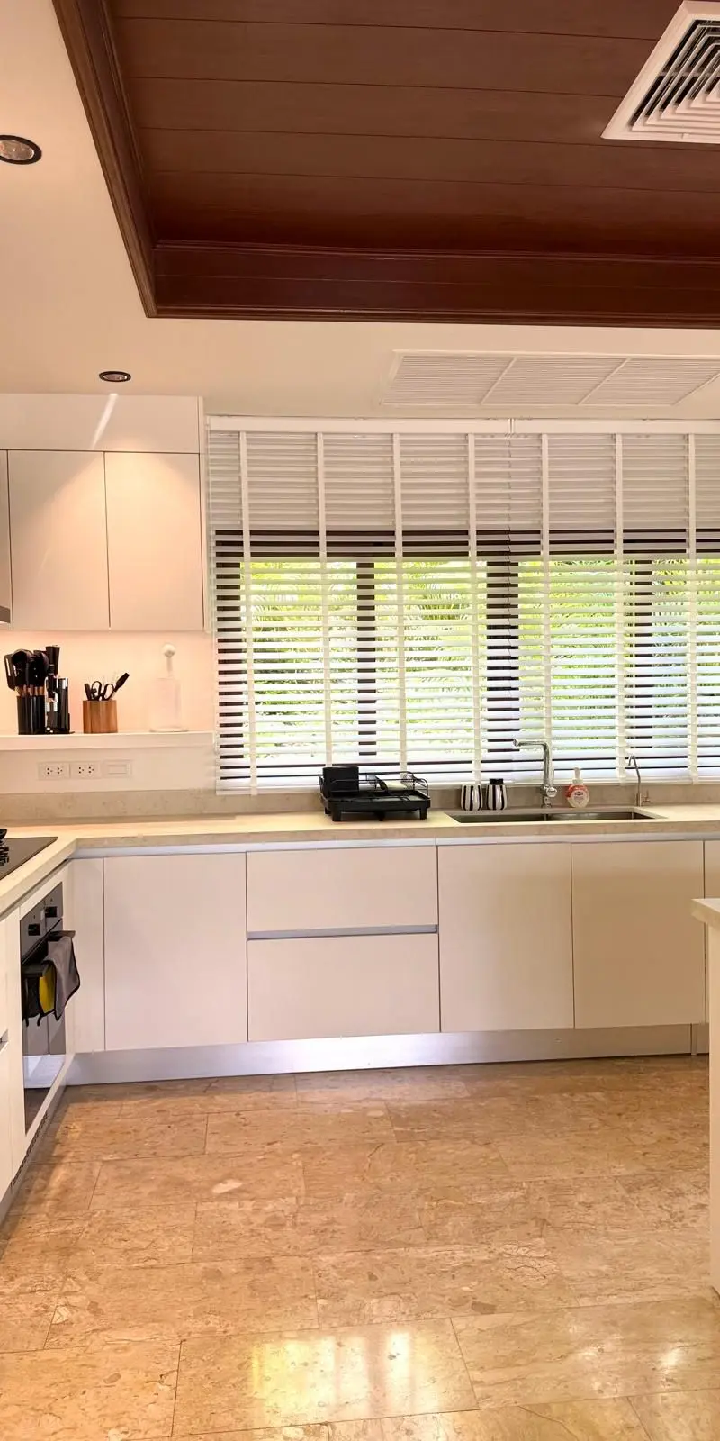Secondary kitchen — minimalist white with U-shape layout