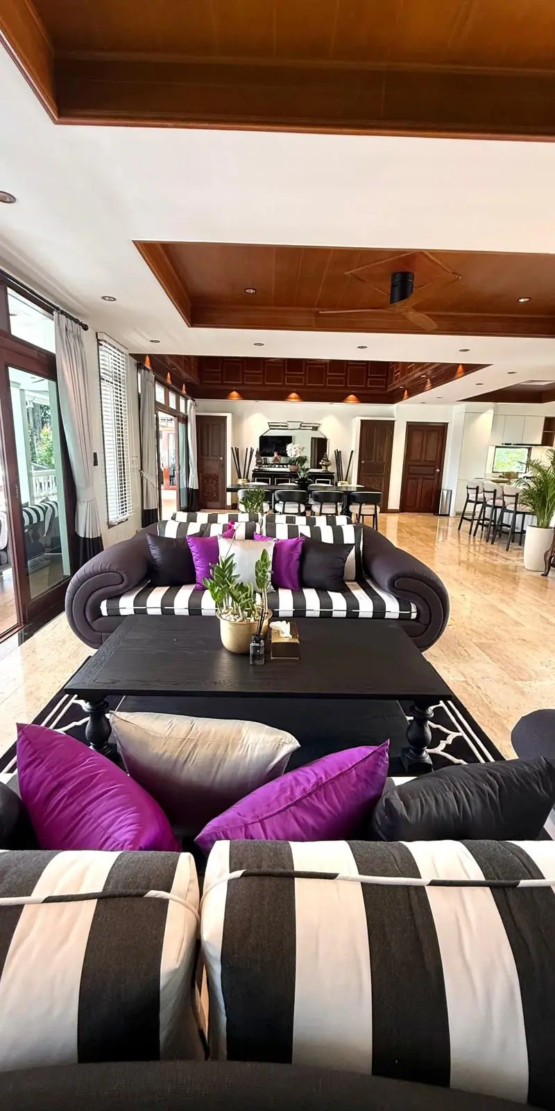 Main living room with vaulted Thai timber ceiling and dual seating zones