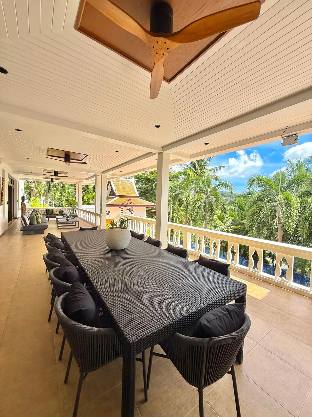Outdoor dining table for ten on the upper covered terrace