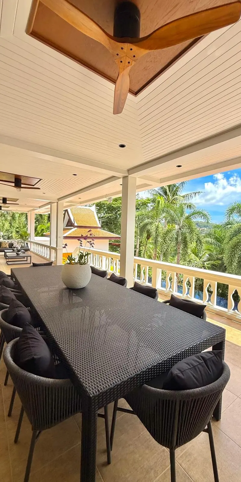 Outdoor dining table for ten on the upper covered terrace