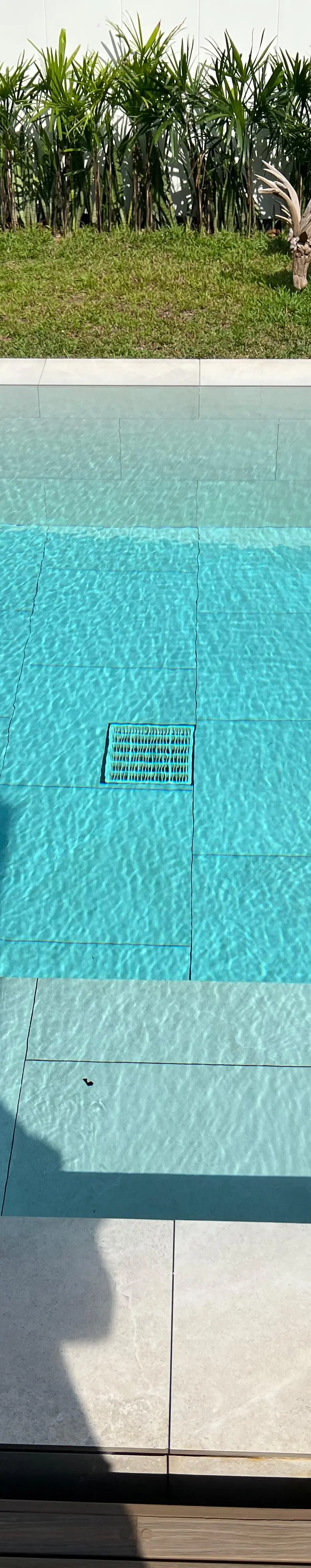 Pool detail with deer and egg sculpture poolside