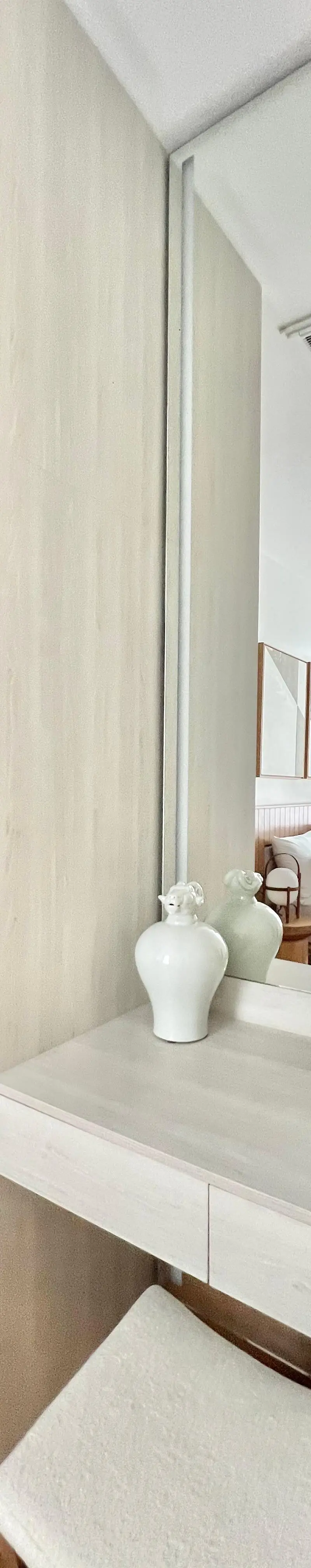 Walk-in closet with glass-front wardrobes and luxury fashion display