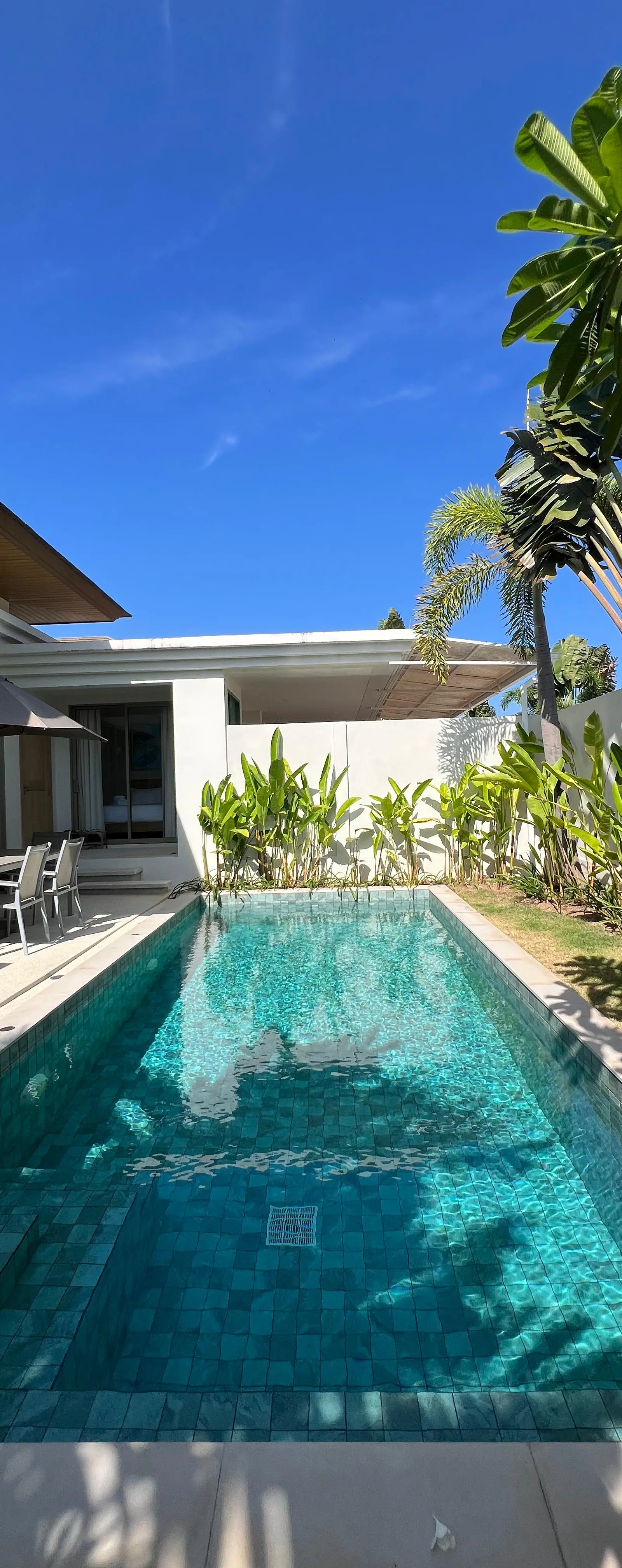 Private pool deck looking down the length of the pool