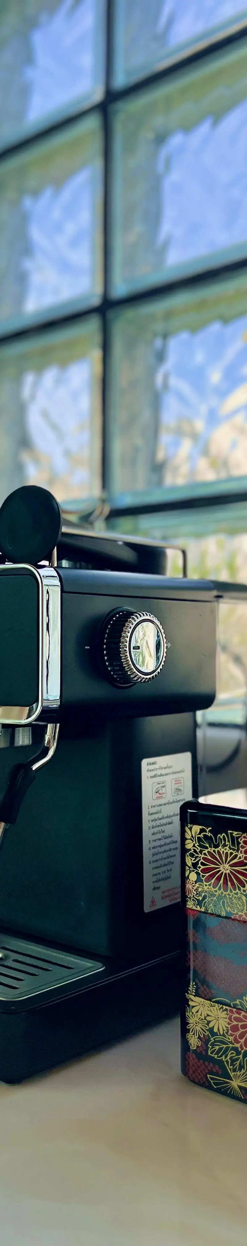 Guest bathroom detail — black-tap toilet and waste basket