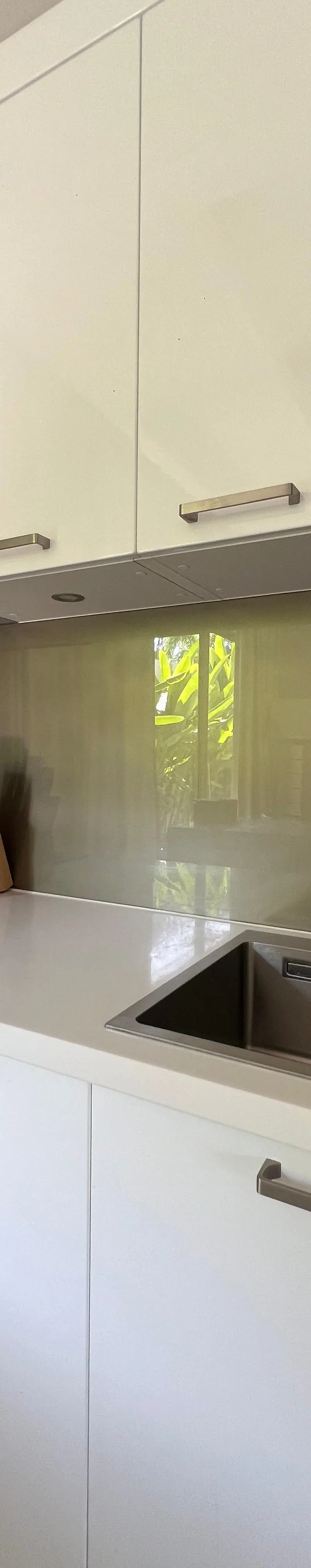 Prep / utility kitchen with coffee machine, microwave and oven